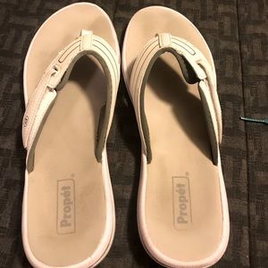 Grey souls. White propel sandals.